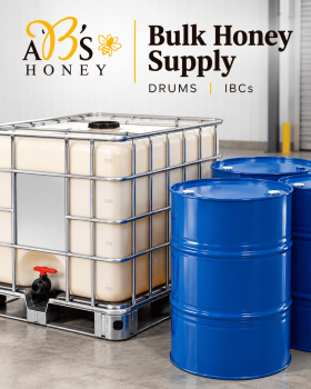 Assorted sizes of AB’s raw Australian honey in plastic tubs with yellow and white lids displayed on