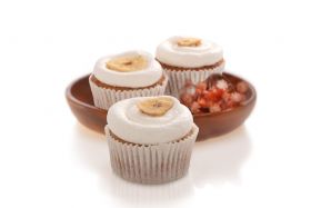 Gluten-free layered cake by Melinda’s Gluten Free Goodies, featuring a frosted sponge cake displayed