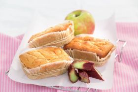 Gluten-free layered cake by Melinda’s Gluten Free Goodies, featuring a frosted sponge cake displayed