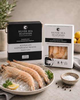 Silver Sea Seafoods Australian Eastern King Prawn retail packs displayed with fresh prawns on ice an