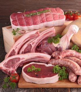 Raw beef cuts including steaks and ribs on a board with herbs and spices, representing Melbourne Mea