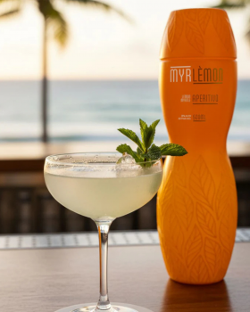 Myrlemon Australian botanical spirit bottle with lemon myrtle and citrus, displayed by the beach sho