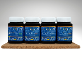 Assorted sizes of AB’s raw Australian honey in plastic tubs with yellow and white lids displayed on