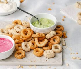 Assorted Continental Tarallini savoury crackers in various flavours arranged on a white table with a