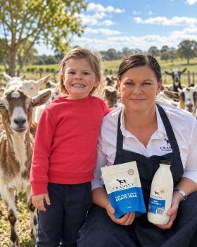 Cranley Dairy Co. raw goat milk and freeze-dried goat milk products displayed with a dairy goat in a