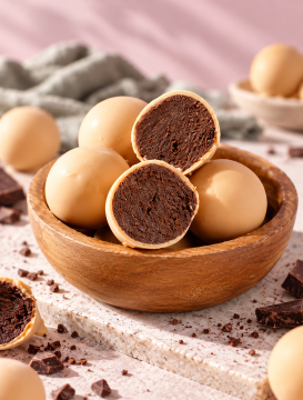 Nourishing By Sally contract manufacturing of wholefood prote balls in coconut and cacao varieties,