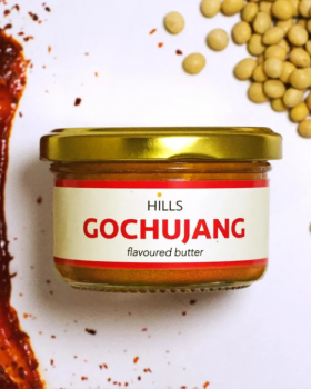 Four Hills Butter flavoured butter varieties in glass jars, including Gochujang, Ceylon, Wasabi and