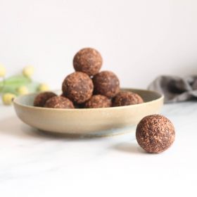 Gluten-free layered cake by Melinda’s Gluten Free Goodies, featuring a frosted sponge cake displayed