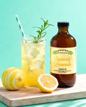 Pyewackets Traditional Apple Cider Vinegar Shrub being poured from an amber glass bottle into a drin