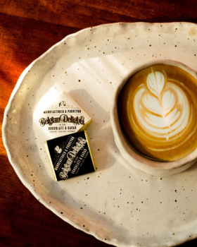 Luxury gift box of assorted Belgian Delights chocolates presented in a gold-trimmed box with ribbon