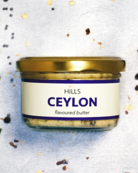 Four Hills Butter flavoured butter varieties in glass jars, including Gochujang, Ceylon, Wasabi and