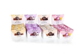Nourishing By Sally Assorted coconut protein balls in bowl including chocolate, raspberry and vanill