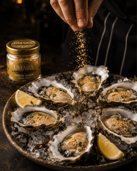 Antarctic Royal Seafood Sardine Garum Umami Dust beside grilled steak finished with a creamy sauce.