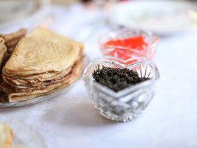 World-class caviar served on a gourmet dish with salmon and herrings, showcasing Harigon Gourmet Foo