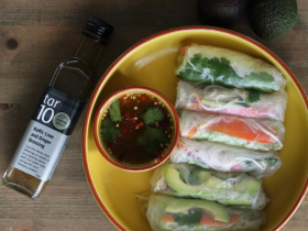 tar10 caramelised balsamic vinegar being drizzled over cheese and bread on a charcuterie board