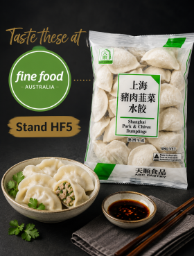 Plate of ABC Pastry Shanghai-style frozen dumplings served with dipping sauce, showcasing authentic