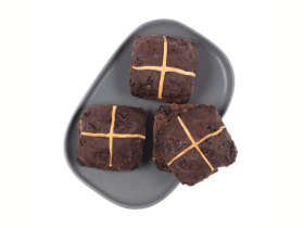 Gluten-free layered cake by Melinda’s Gluten Free Goodies, featuring a frosted sponge cake displayed