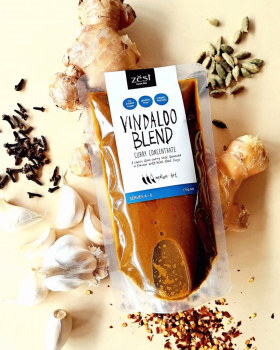 Zest Byron Bay spice pastes and curry blends displayed on a pink background with the brand logo.