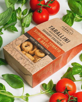 Assorted Continental Tarallini savoury crackers in various flavours arranged on a white table with a