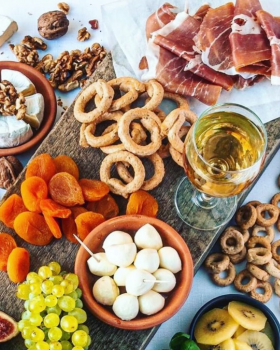 Assorted Continental Tarallini savoury crackers in various flavours arranged on a white table with a