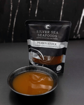 Silver Sea Seafoods Australian Eastern King Prawn retail packs displayed with fresh prawns on ice an