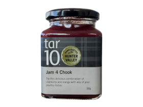 tar10 caramelised balsamic vinegar being drizzled over cheese and bread on a charcuterie board