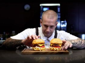 Grilled beef steaks cooking over flame on barbecue grill, showcasing premium wholesale meat from Few