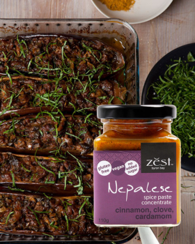 Zest Byron Bay spice pastes and curry blends displayed on a pink background with the brand logo.