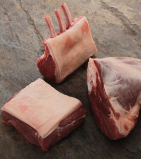 Raw beef cuts including steaks and ribs on a board with herbs and spices, representing Melbourne Mea