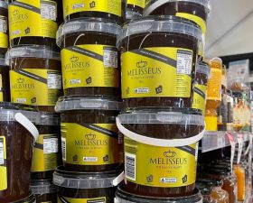 Australian label printing production line with custom branded product labels on rolls, showcasing Br