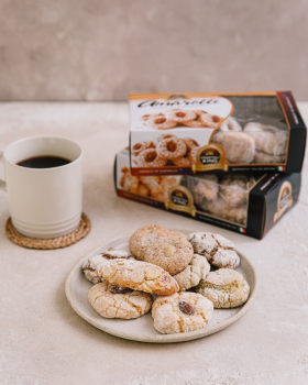 Bowl of Crostoli King crostoli pastries dusted with icing sugar, showcasing thin, crispy Italian swe