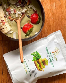 Indus Farms superfood powders with vibrant yellow and red fruit powders surrounded by mango slices a