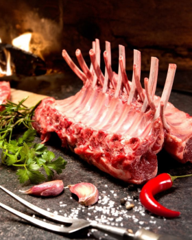 Raw beef cuts including steaks and ribs on a board with herbs and spices, representing Melbourne Mea