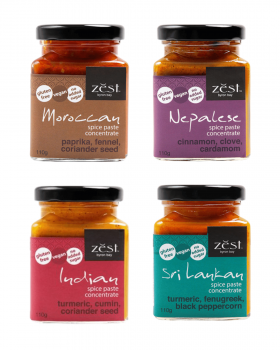 Zest Byron Bay spice pastes and curry blends displayed on a pink background with the brand logo.