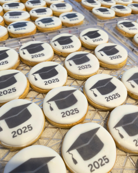 Artisan Delights logo with text reading “Iced Gingerbread Cookies” and “Custom Promotional Cookies”