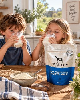 Cranley Dairy Co. raw goat milk and freeze-dried goat milk products displayed with a dairy goat in a