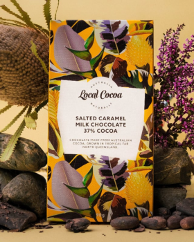 Local Cocoa Australia logo reading “Local Cocoa – Naturally” over an aerial view of lush green fores