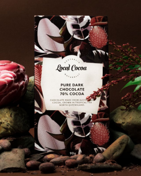 Local Cocoa Australia logo reading “Local Cocoa – Naturally” over an aerial view of lush green fores