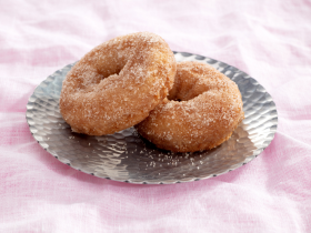 Gluten-free layered cake by Melinda’s Gluten Free Goodies, featuring a frosted sponge cake displayed