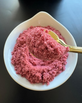 Indus Farms superfood powders with vibrant yellow and red fruit powders surrounded by mango slices a