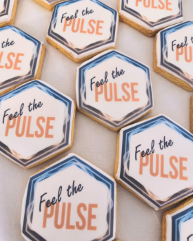 Artisan Delights logo with text reading “Iced Gingerbread Cookies” and “Custom Promotional Cookies”