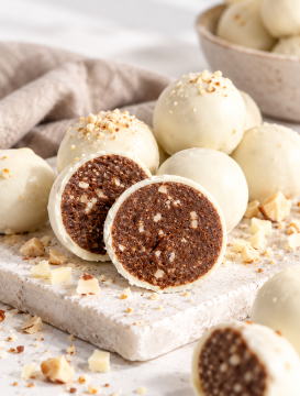 Nourishing By Sally contract manufacturing of wholefood prote balls in coconut and cacao varieties,
