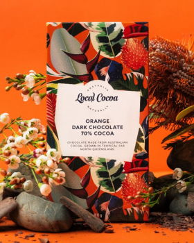 Local Cocoa Australia logo reading “Local Cocoa – Naturally” over an aerial view of lush green fores