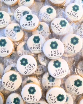 Artisan Delights logo with text reading “Iced Gingerbread Cookies” and “Custom Promotional Cookies”