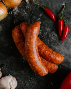Raw beef cuts including steaks and ribs on a board with herbs and spices, representing Melbourne Mea