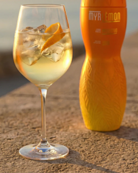 Myrlemon Australian botanical spirit bottle with lemon myrtle and citrus, displayed by the beach sho
